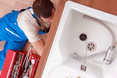 plumber in Morgan Hill installs a kitchen sink